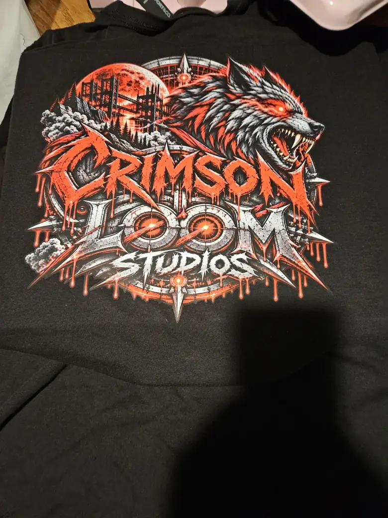 Real black shirt featuring the Crimson Loom Studios print